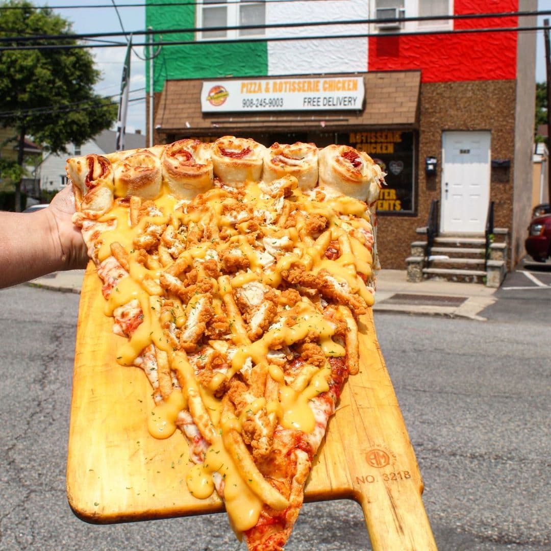     Pizza gigante del asador Joe' | La nueva tendencia gastronómica es una porción de pizza gigante: la más grande que jamás hayas visto | su belleza